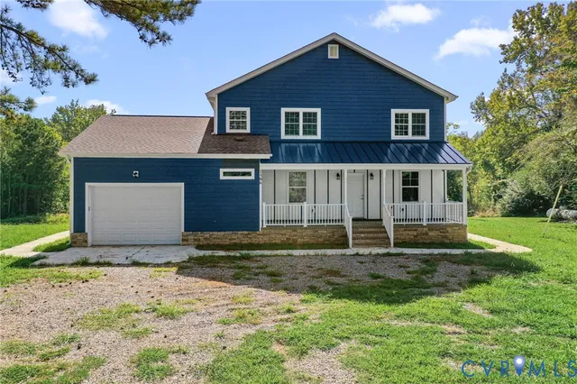 a house that has a big yard in front of it