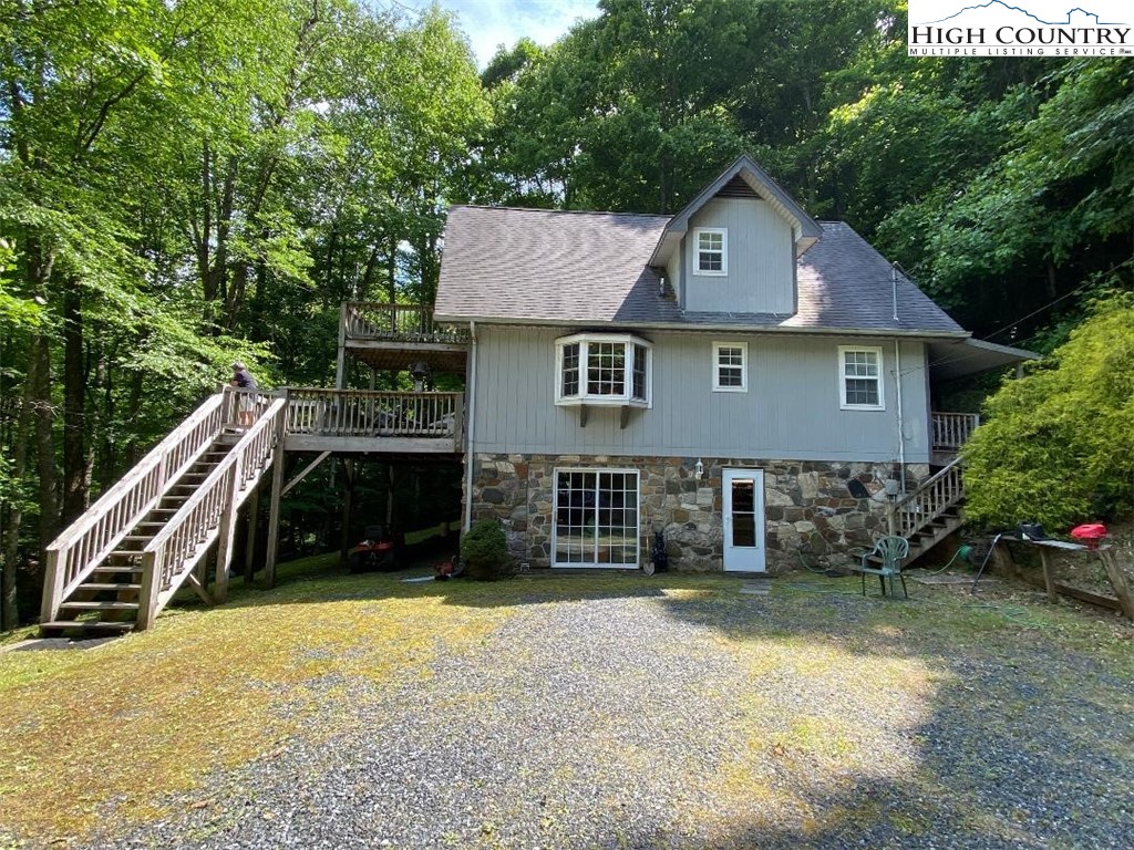 2446 3 Top Road Creston, NC 28615 - Photo 1 of 22 a front view of a house with a yard
