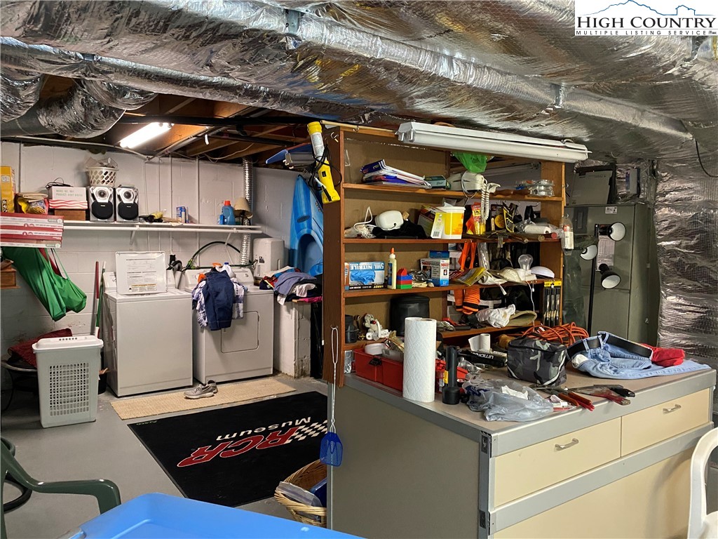 2446 3 Top Road Creston, NC 28615 - Photo 11 of 22 a storage room with washer and dryer