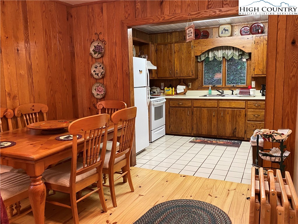 2446 3 Top Road Creston, NC 28615 - Photo 5 of 22 a view of kitchen with stainless steel appliances kitchen island granite countertop a stove a sink and a dining table