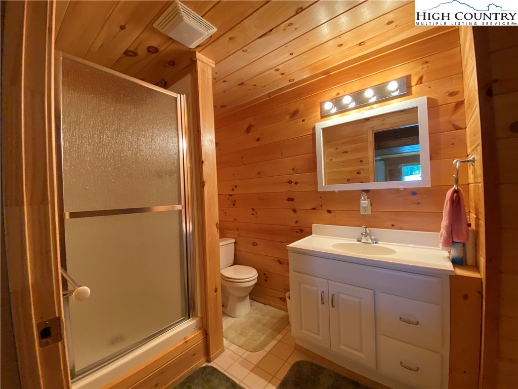 2446 3 Top Road Creston, NC 28615 - Photo 10 of 22 a bathroom with a sink toilet and shower
