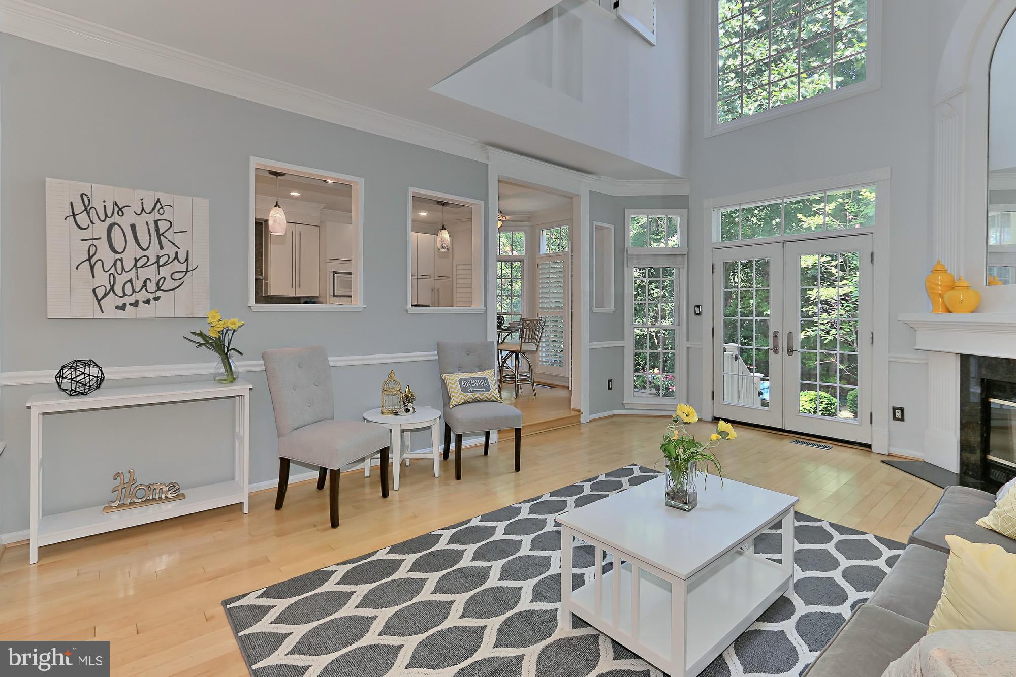 11424 Hollow Timber Way Reston, VA 20194 - Photo 2 of 30 Spacious Living Rm w/ Wall of Windows + Gas FP