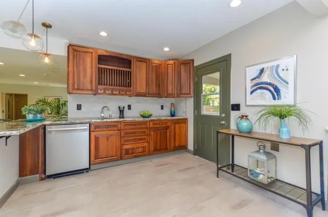 a kitchen with sink cabinets and window