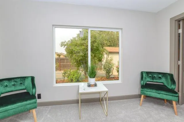 a living room with furniture and a window