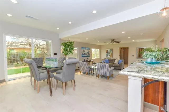 a view of a dining room with furniture window and outside view
