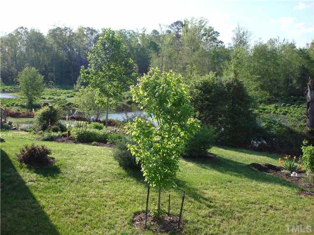 3224 Sandy Bluff Road Raleigh, NC 27616 - Photo 13 of 14 a view of a garden with a building
