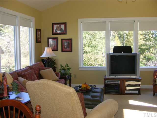 3224 Sandy Bluff Road Raleigh, NC 27616 - Photo 7 of 14 a living room with furniture and a flat screen tv