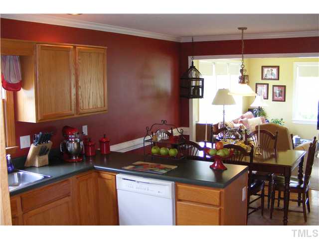 3224 Sandy Bluff Road Raleigh, NC 27616 - Photo 8 of 14 a kitchen with a table and chairs in it