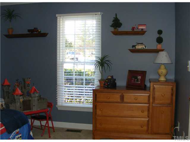 3224 Sandy Bluff Road Raleigh, NC 27616 - Photo 10 of 14 a living room with furniture and a window
