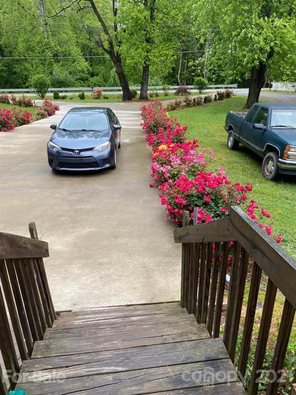 599 Pace Road Hendersonville, NC 28792 - Photo 21 of 24 a view of yard with seating area and trees