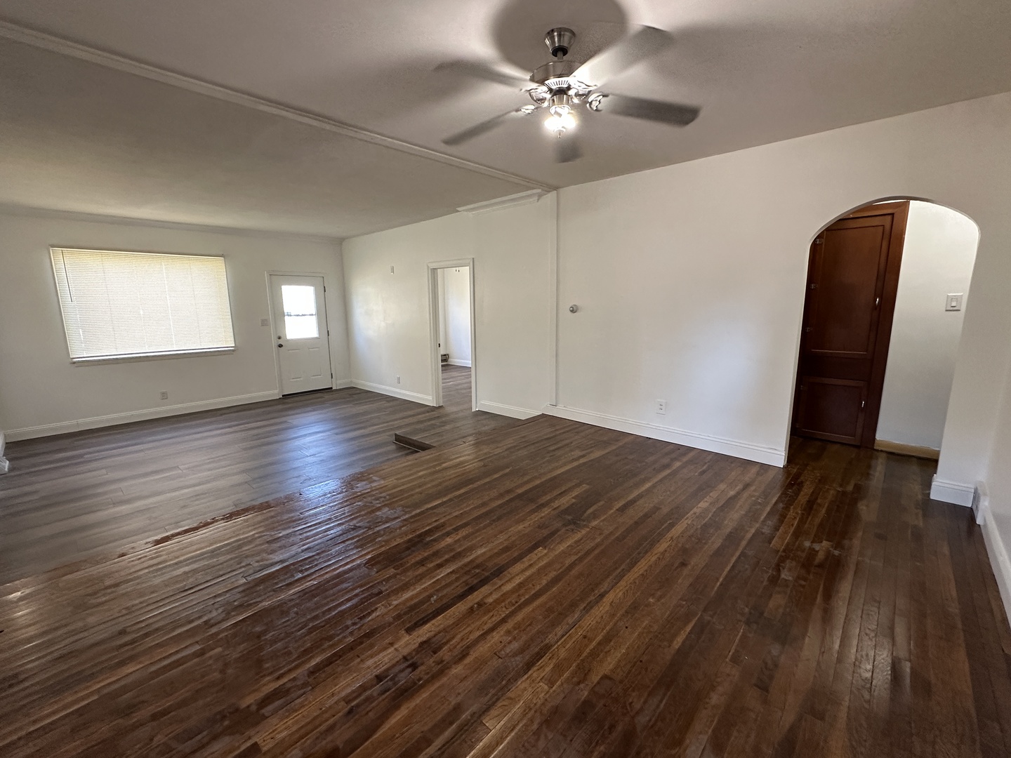 1202 East Jefferson Street Clinton, IL 61727 - Photo 7 of 19 a view of empty room with wooden floor and fan