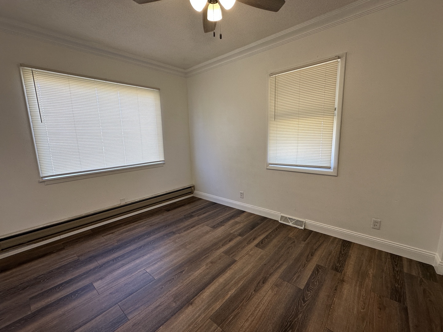 1202 East Jefferson Street Clinton, IL 61727 - Photo 9 of 19 a view of an empty room with wooden floor and a window