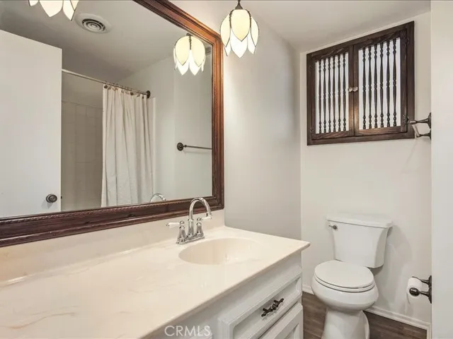 a view of a room with a windows and cabinet