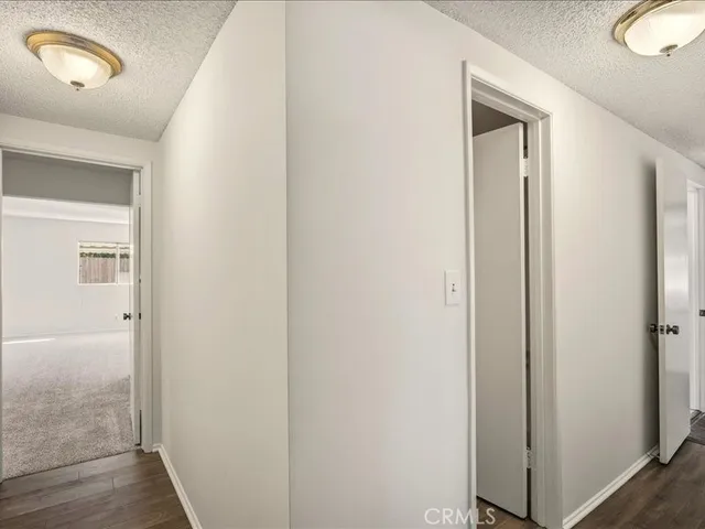 a view of a room with a sink and mirror