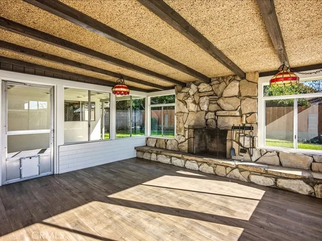 a view of backyard with swimming pool