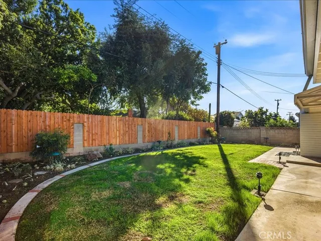 a view of a house with backyard porch and sitting area