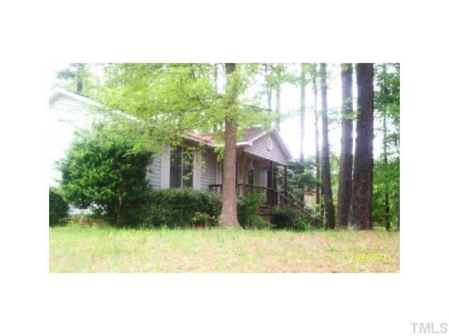 2713 Milburnie Road Raleigh, NC 27610 - Photo 1 of 6 a view of a house with a yard