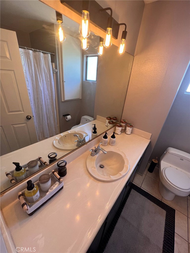 69646 Antonia Way Rancho Mirage, CA 92270 - Photo 7 of 50 a bathroom with a sink vanity and a mirror