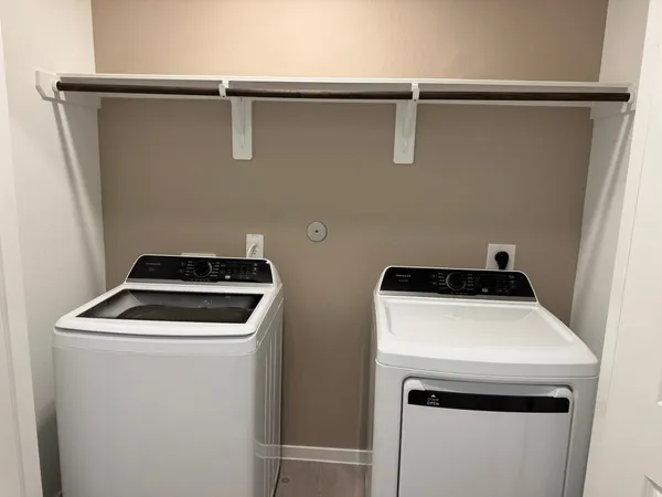 a utility room with dryer and washer