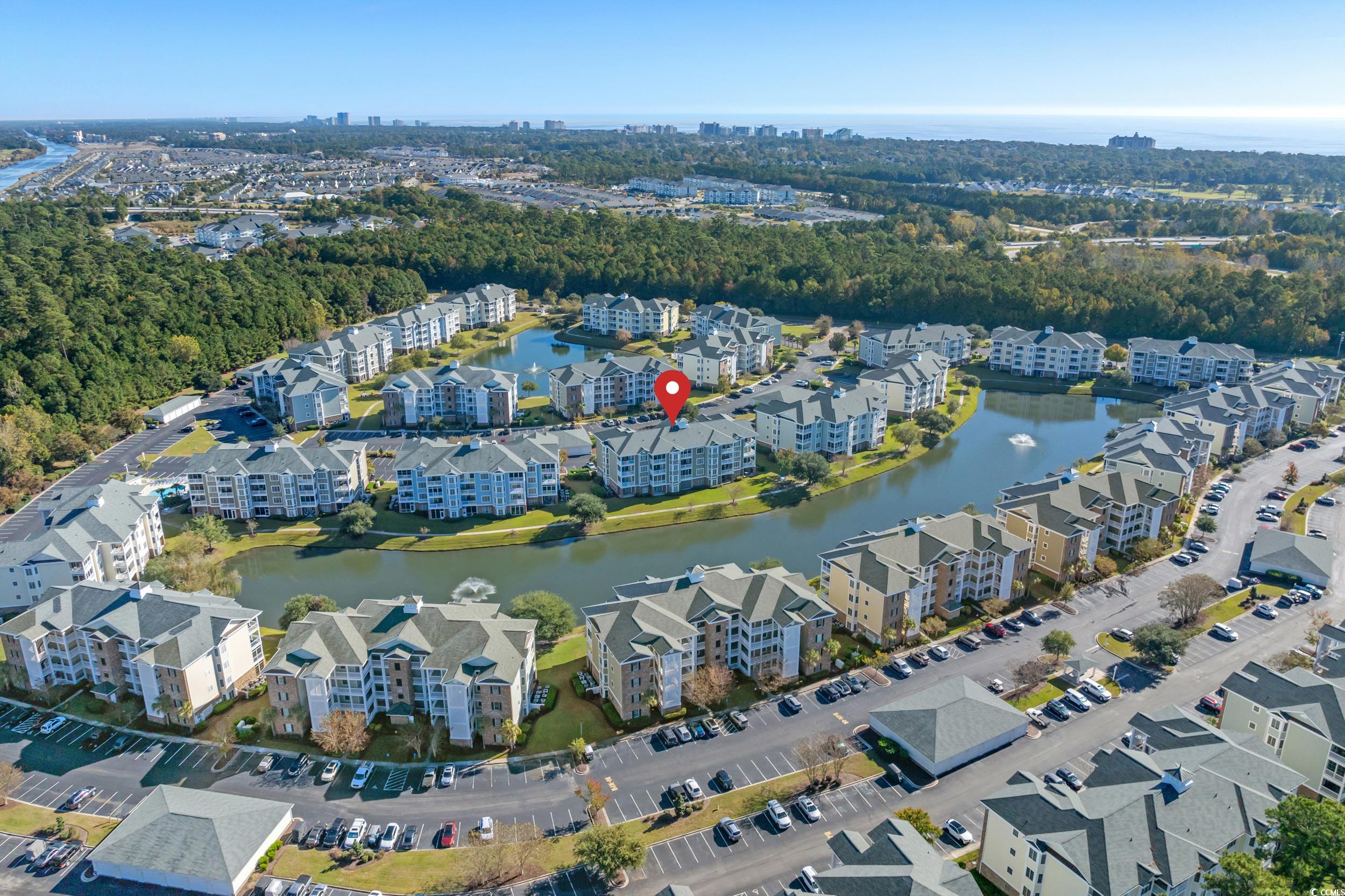 4823 Magnolia Lake Drive, Unit 101 Myrtle Beach, SC 29577 - Photo 2 of 35 View of urban area with a large body of water