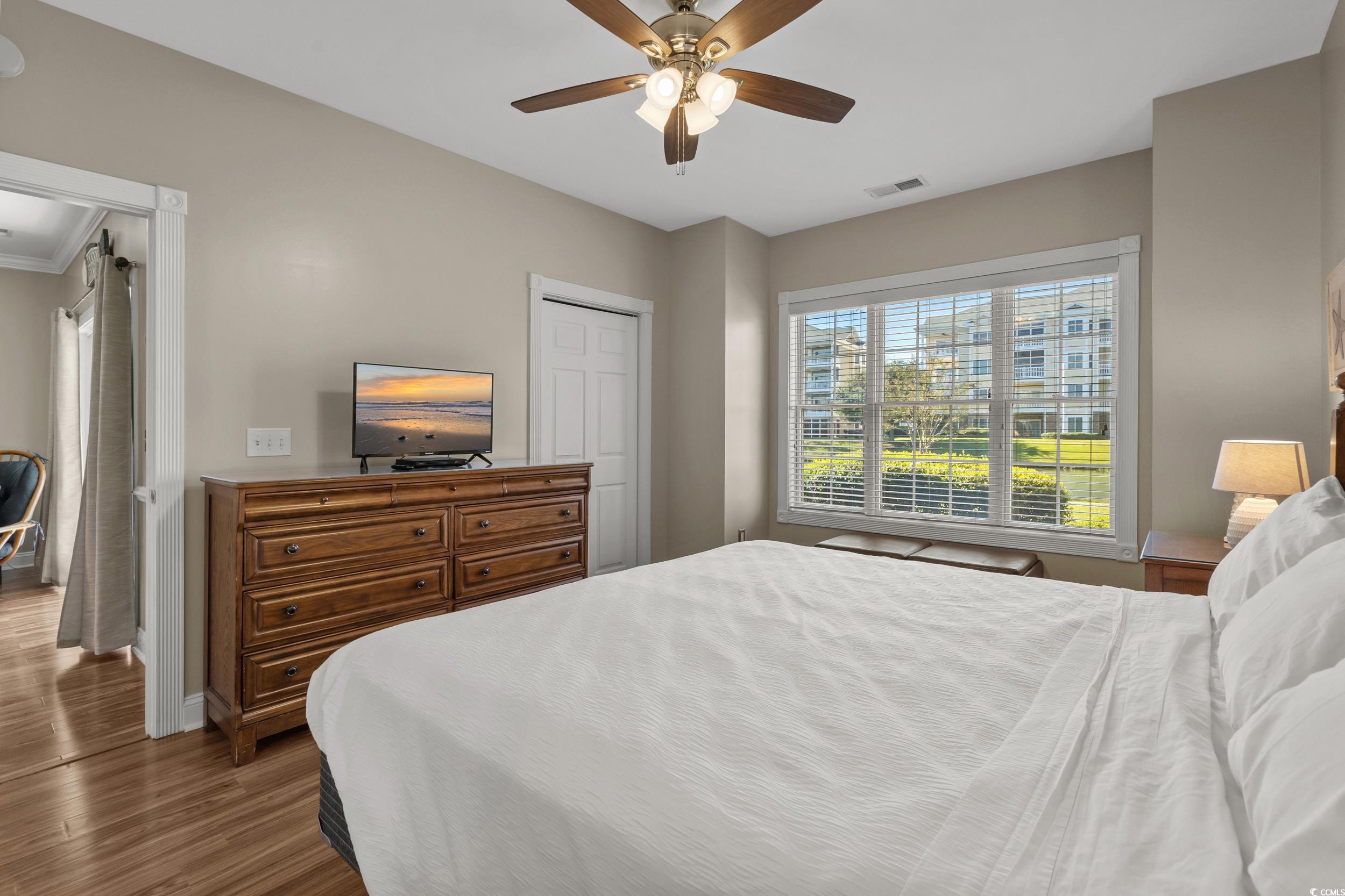 4823 Magnolia Lake Drive, Unit 101 Myrtle Beach, SC 29577 - Photo 19 of 35 Bedroom featuring dark wood finished floors and a ceiling fan