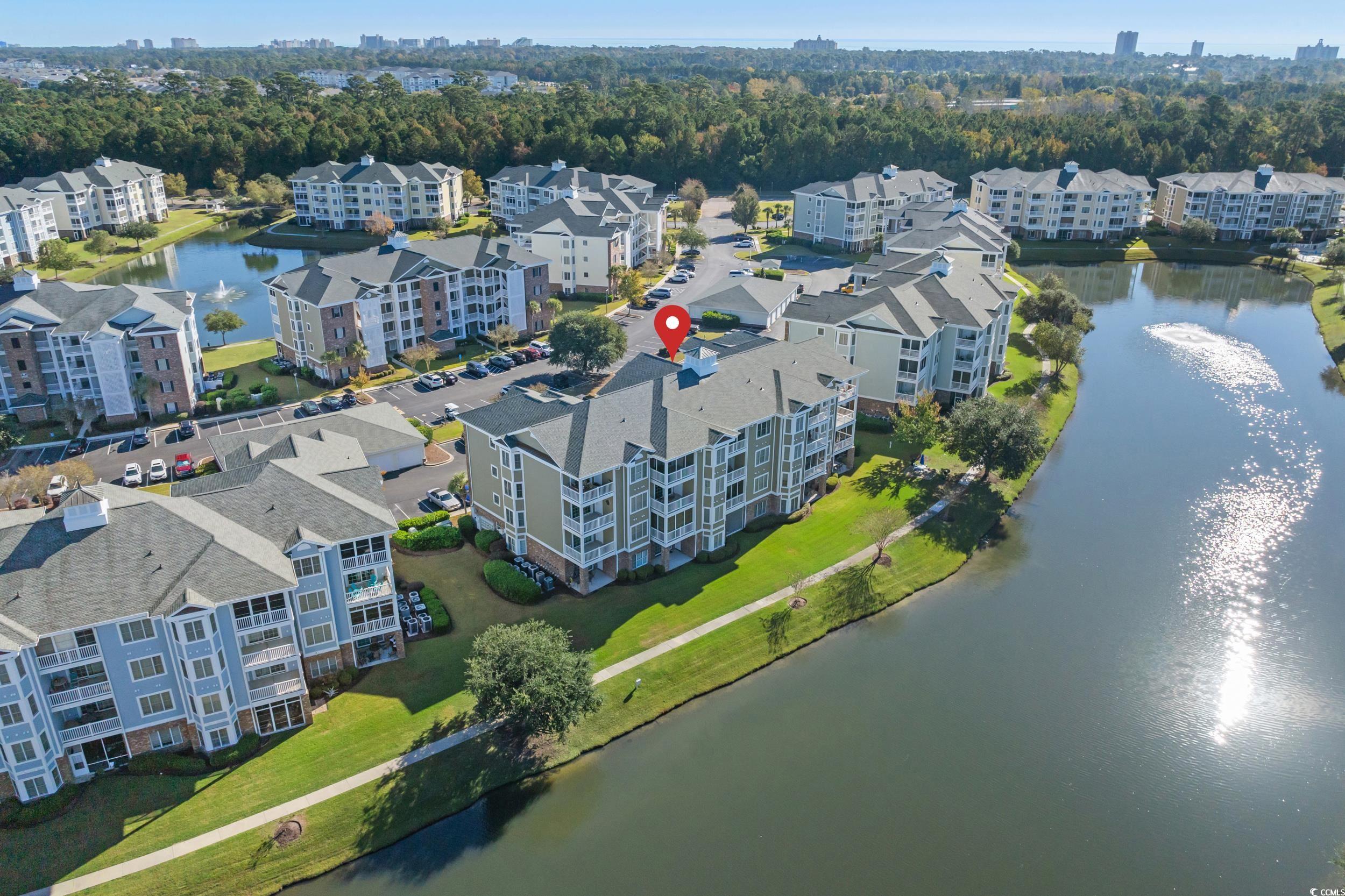 4823 Magnolia Lake Drive, Unit 101 Myrtle Beach, SC 29577 - Photo 29 of 35 Aerial view of a nearby body of water