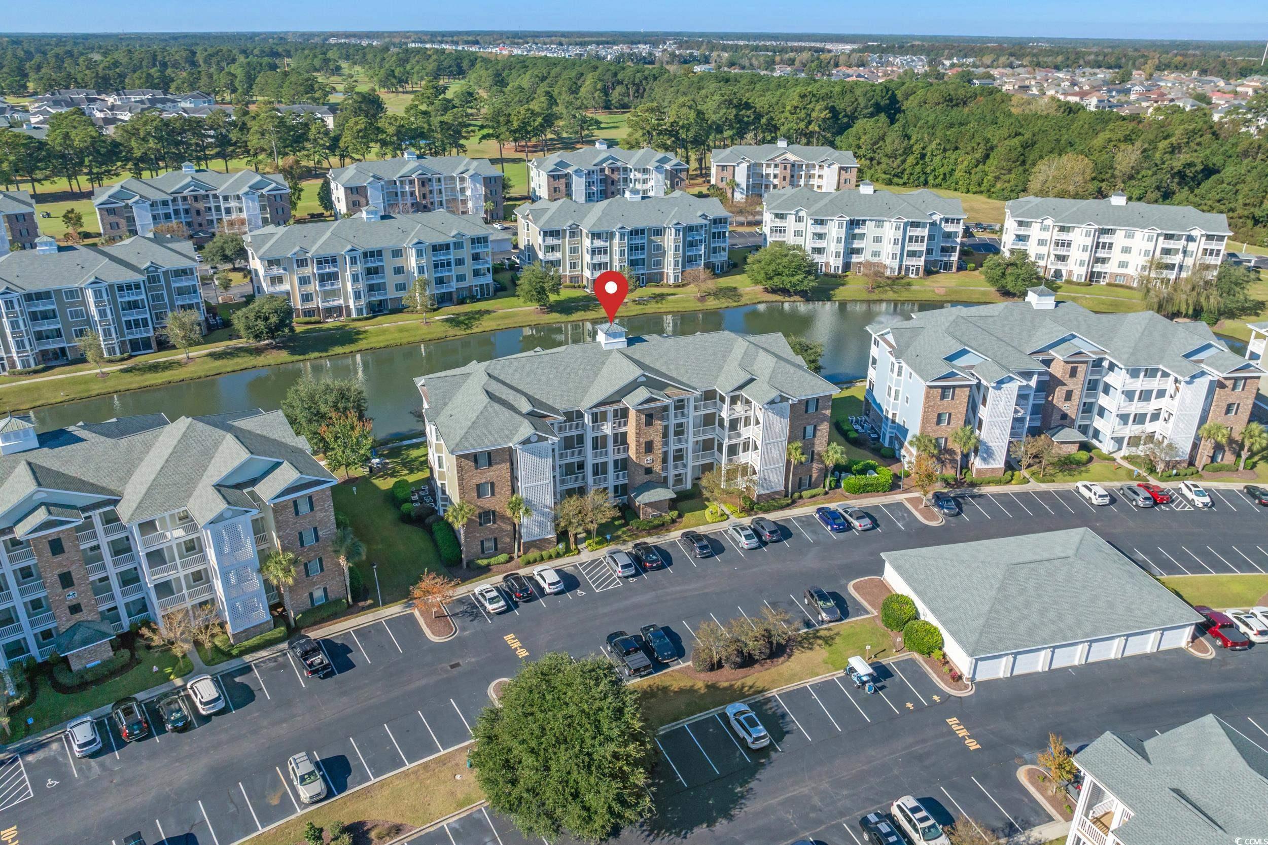 4823 Magnolia Lake Drive, Unit 101 Myrtle Beach, SC 29577 - Photo 30 of 35 Aerial view of property's location featuring apartment complex / building and a large body of water