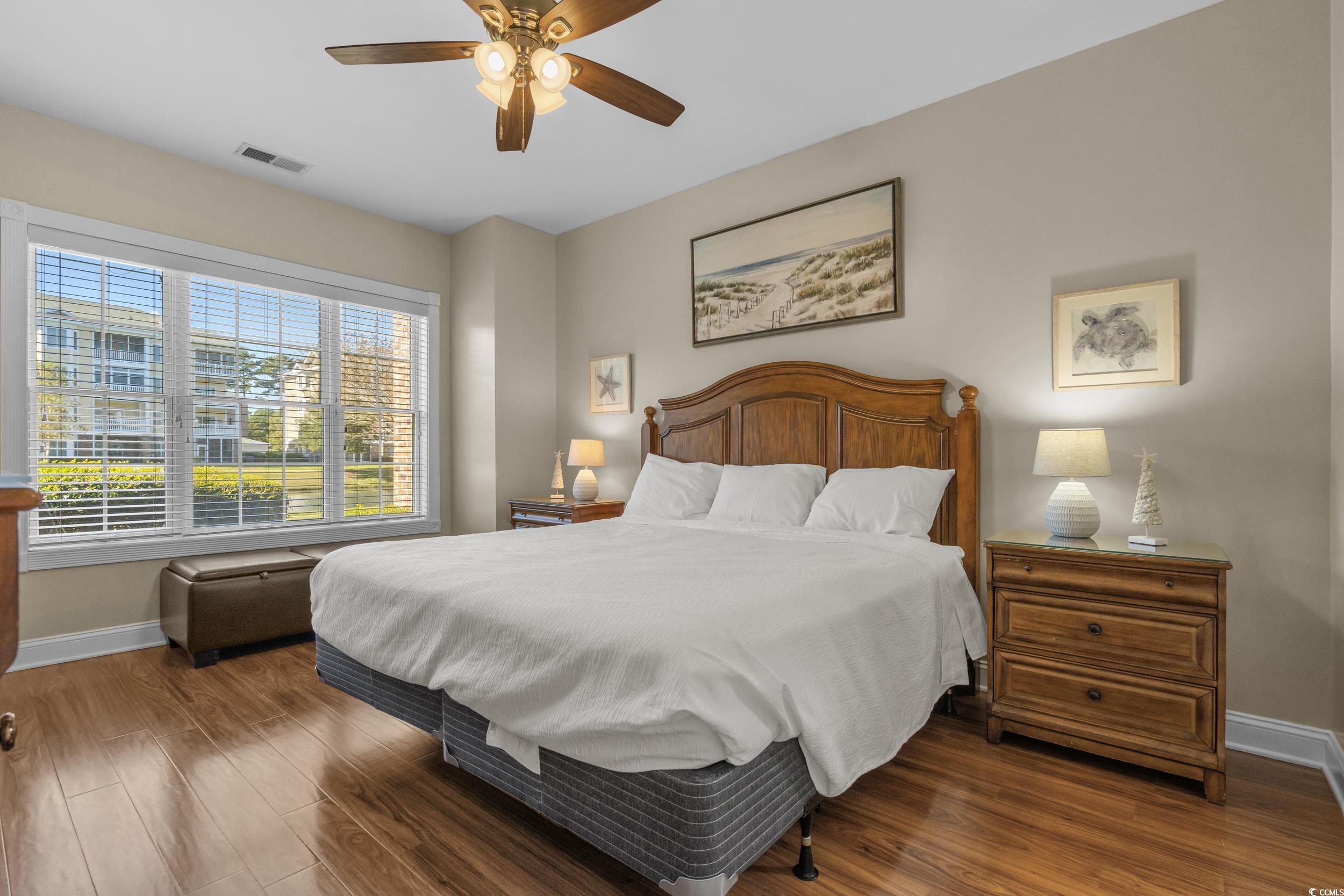 4823 Magnolia Lake Drive, Unit 101 Myrtle Beach, SC 29577 - Photo 5 of 35 Bedroom with wood finished floors and a ceiling fan