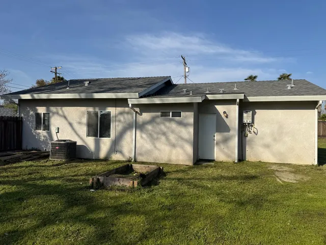 a view of a front of a house with a yard