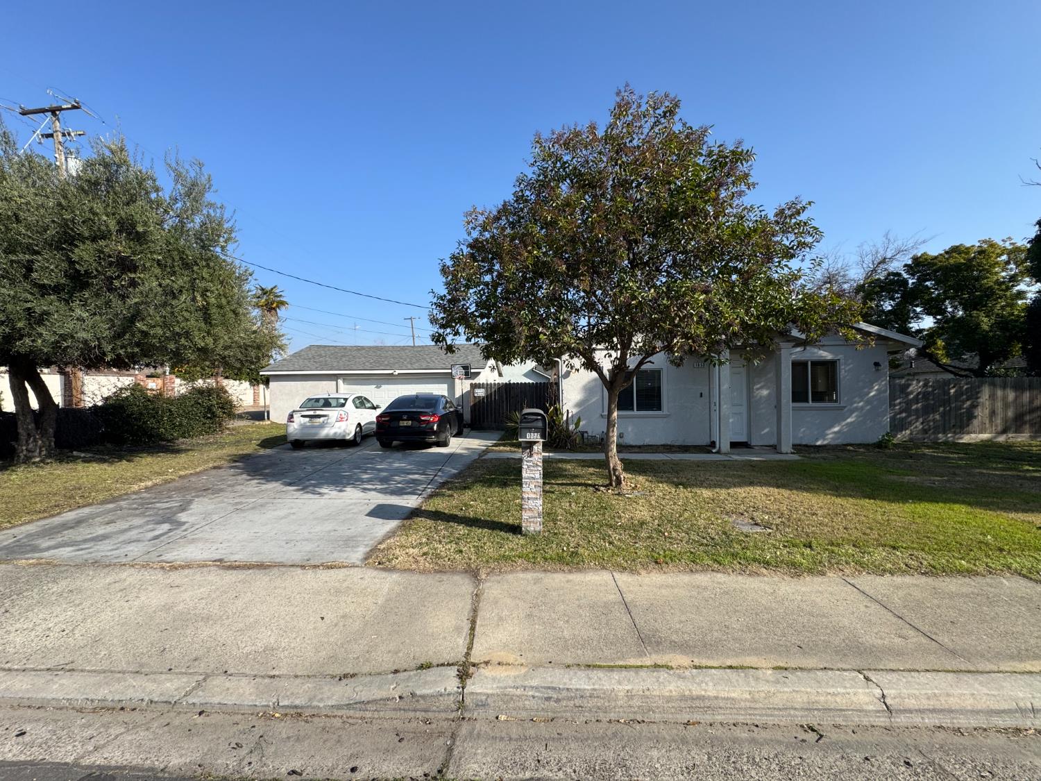 1650 North Olive Avenue Turlock, CA 95382 - Photo 2 of 21 a front view of a house with a yard