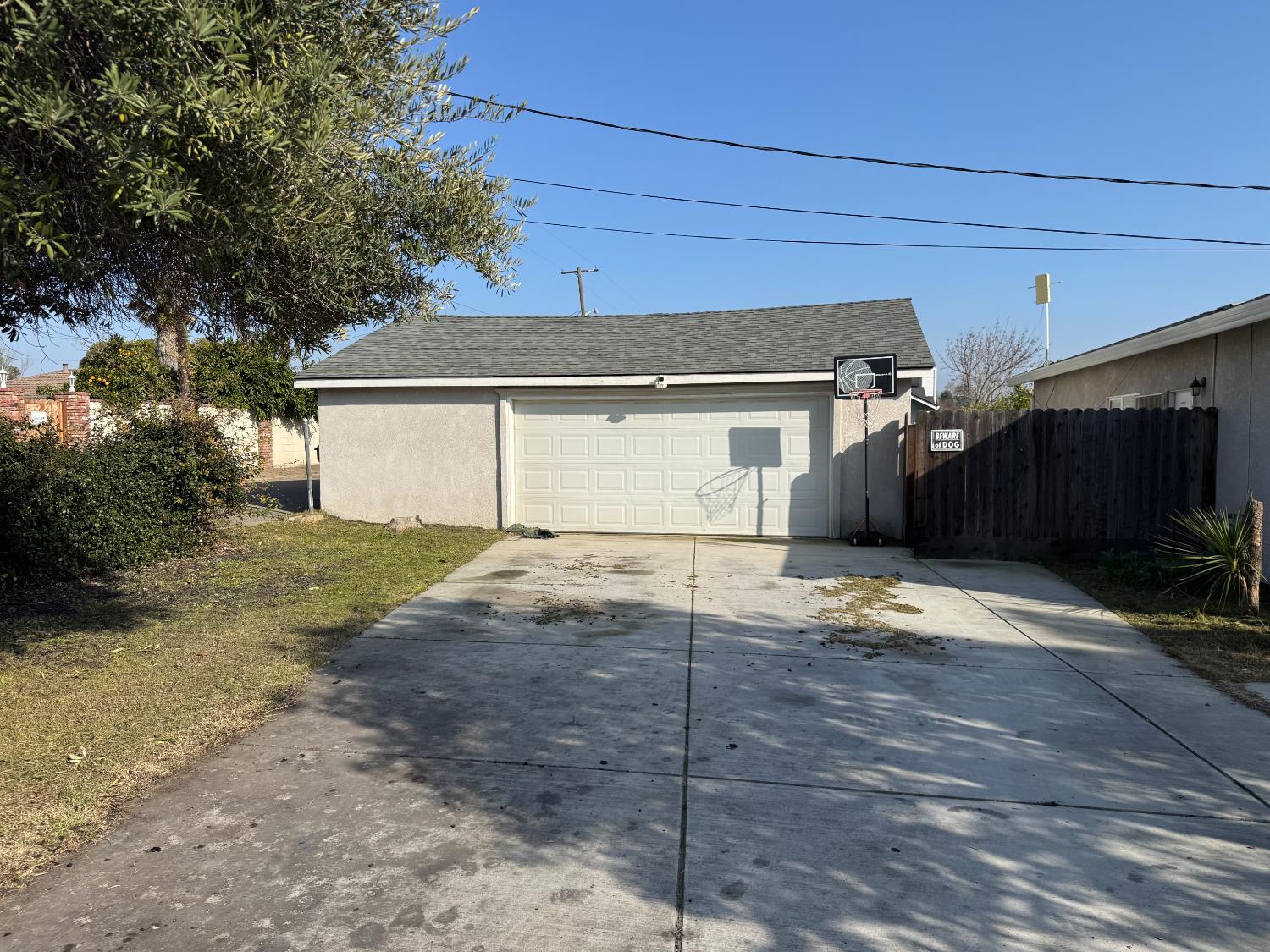 1650 North Olive Avenue Turlock, CA 95382 - Photo 21 of 21 a front view of a house with a yard and garage