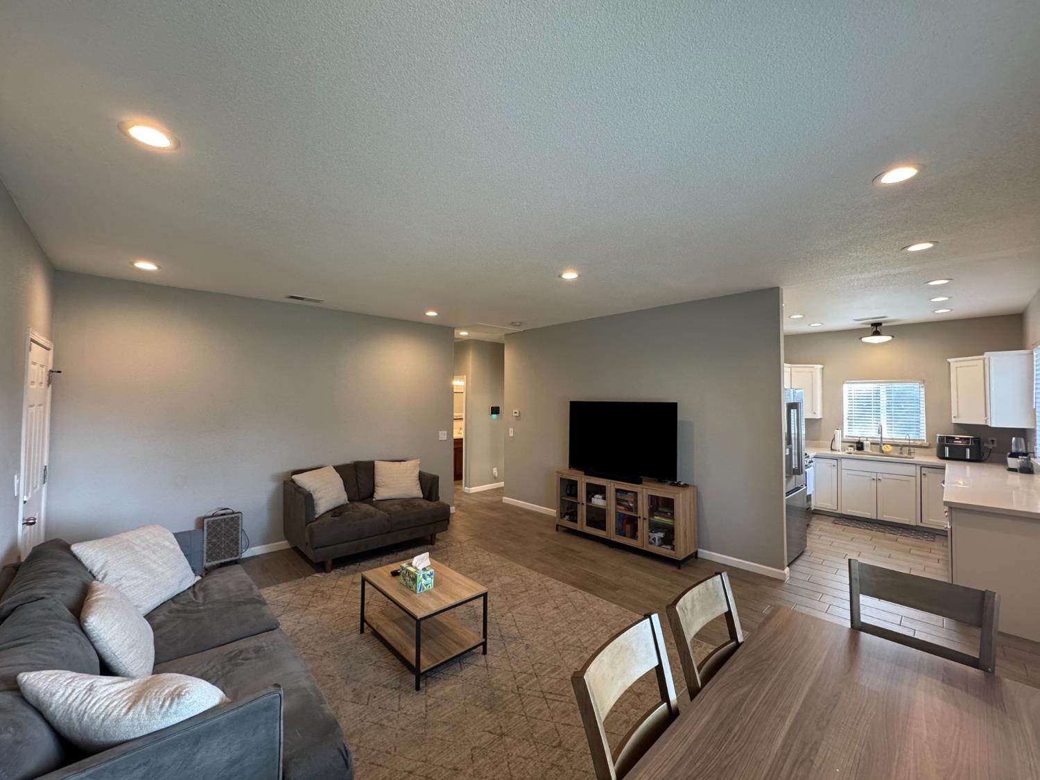 1650 North Olive Avenue Turlock, CA 95382 - Photo 5 of 21 a living room with furniture and a flat screen tv