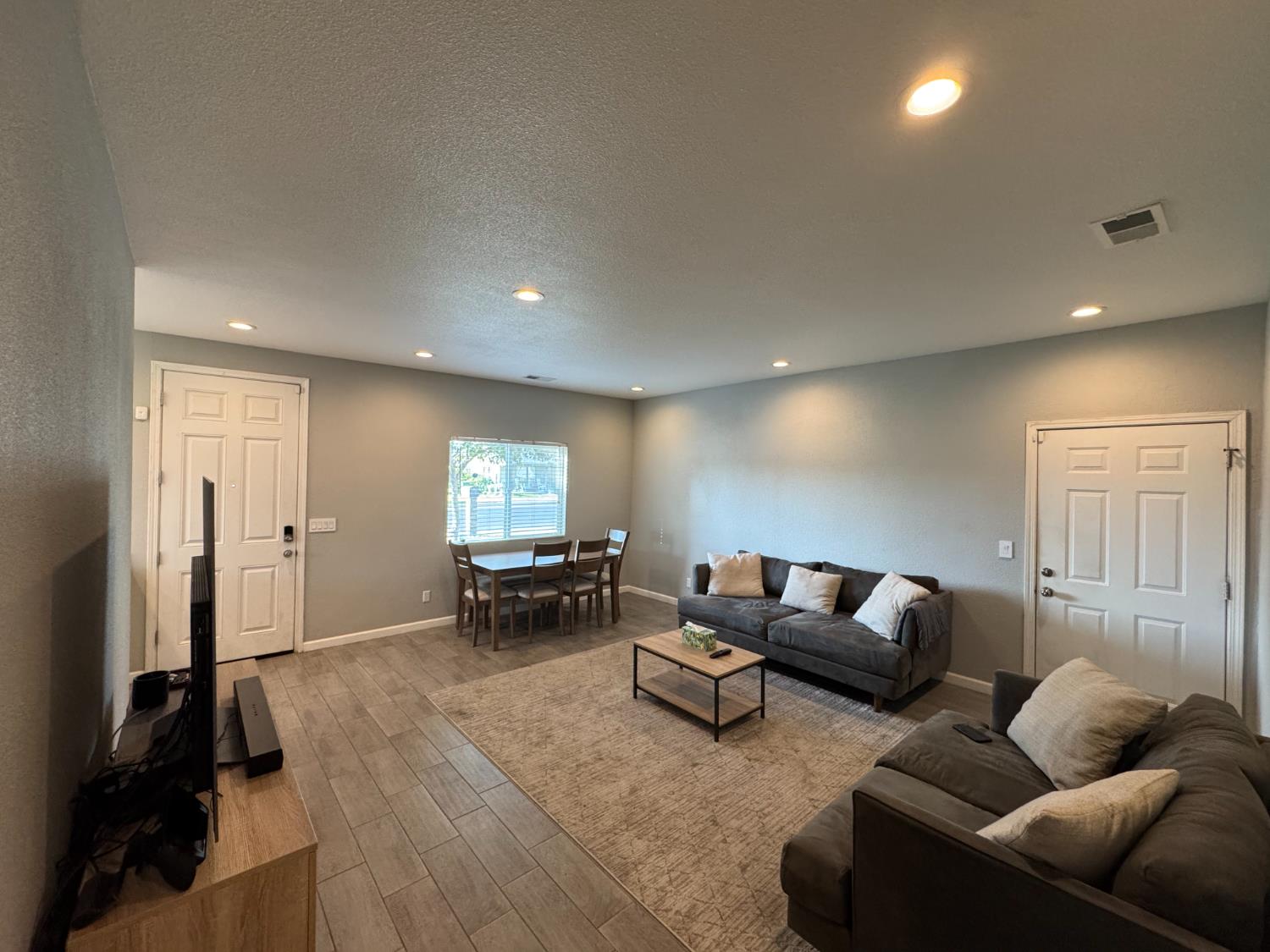 1650 North Olive Avenue Turlock, CA 95382 - Photo 6 of 21 a living room with furniture and a flat screen tv