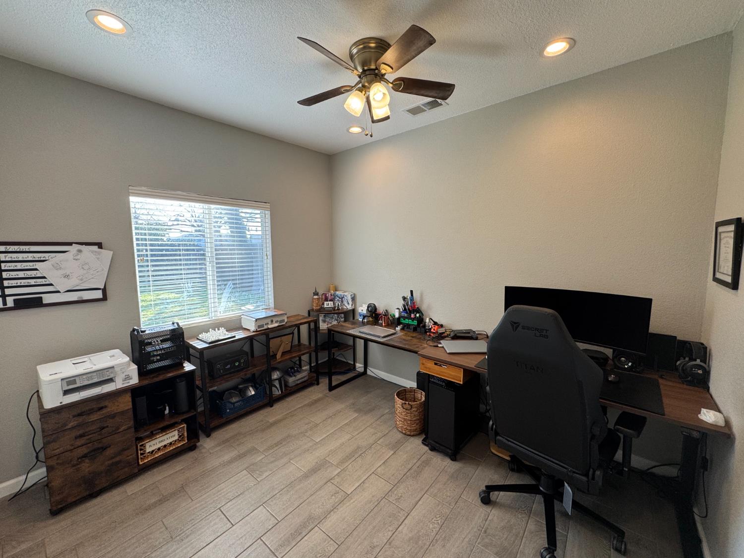 1650 North Olive Avenue Turlock, CA 95382 - Photo 7 of 21 a livingroom with workspace and a window