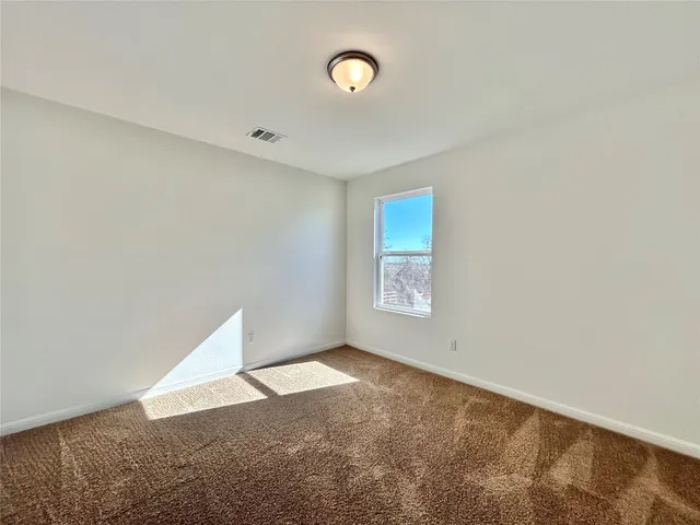 a bathroom with a shower and a toilet