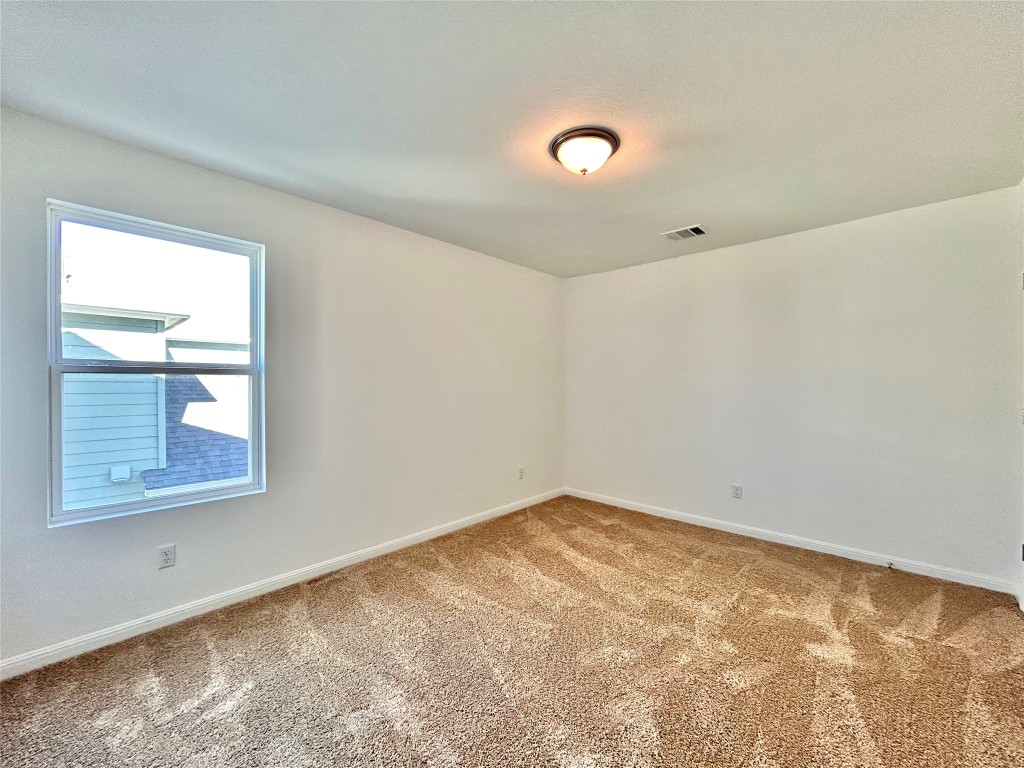 202 Pebblestream Pass Taylor, TX 76574 - Photo 28 of 35 an empty room with a window