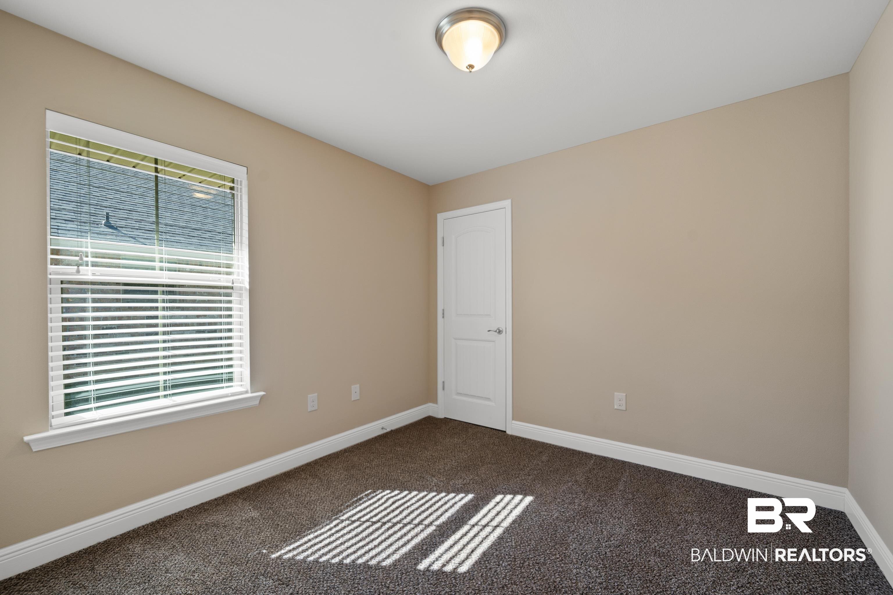 22631 Lake South Drive Foley, AL 36535 - Photo 15 of 25 Unfurnished room featuring carpet floors
