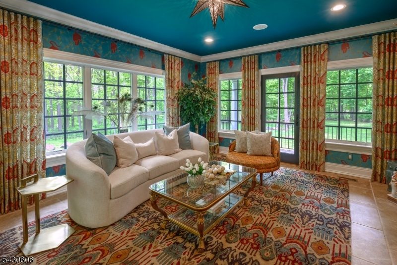 5 Burnett Road Mendham, NJ 07945 - Photo 17 of 50 a living room with furniture and a floor to ceiling window