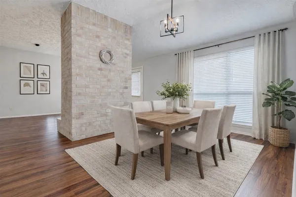 a view of a house with a large tree and a big yard