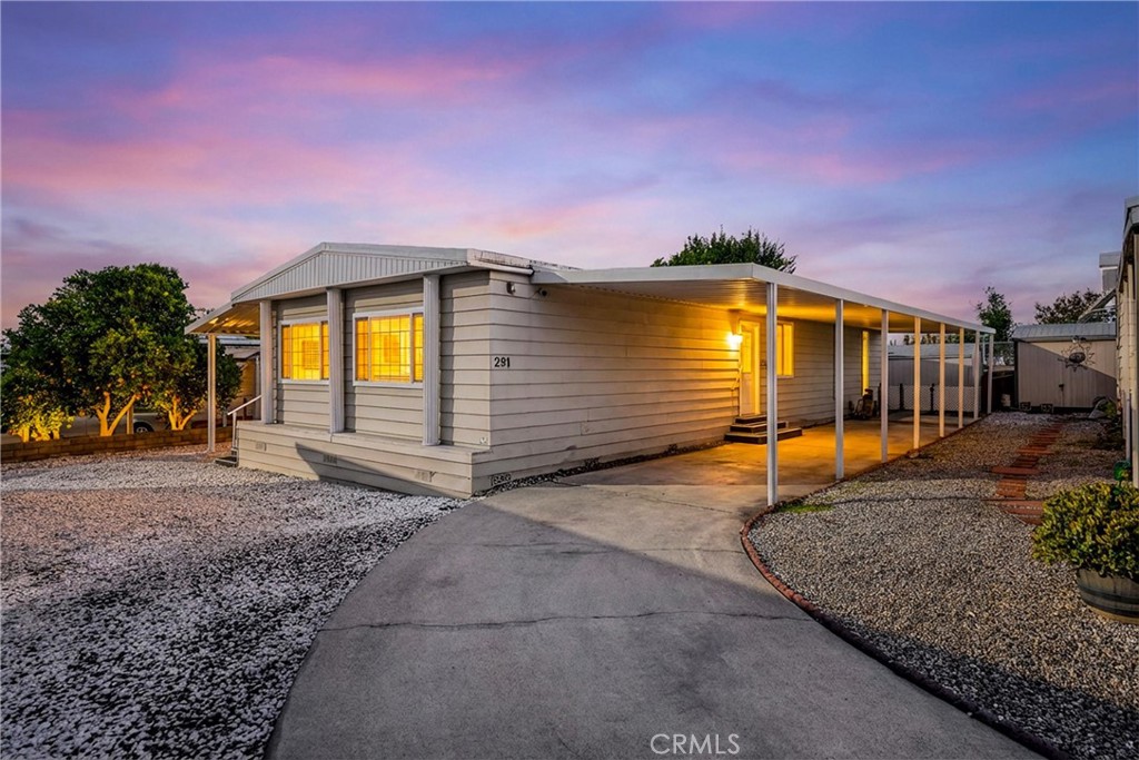 10210 Base Line Road, Unit 291 Rancho Cucamonga, CA 91701 - Photo 1 of 27 a front view of a house with a yard