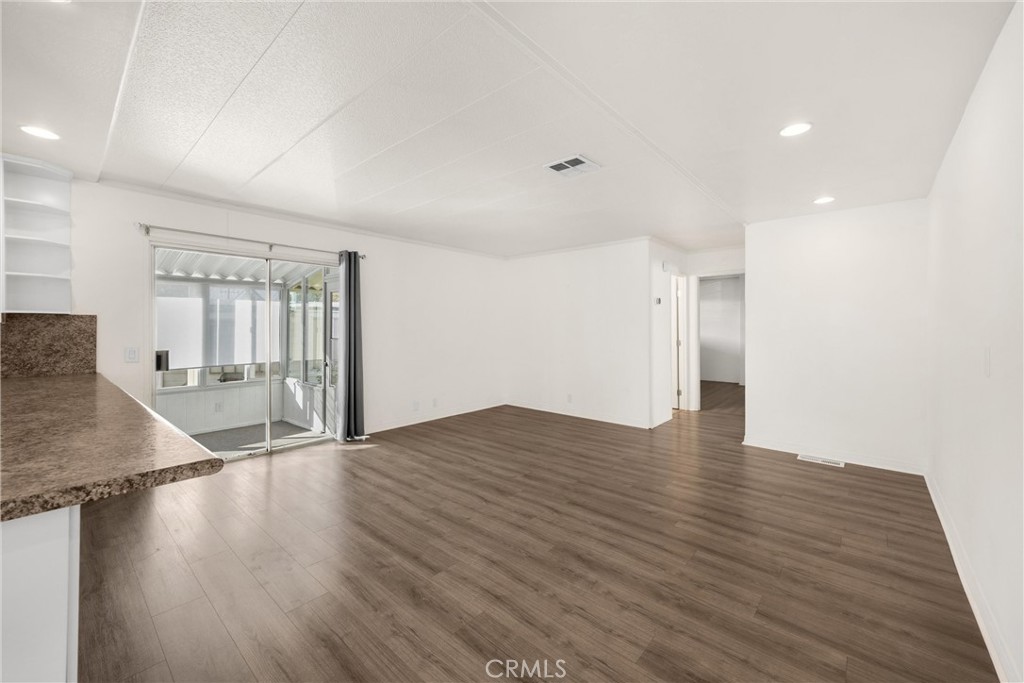 10210 Base Line Road, Unit 291 Rancho Cucamonga, CA 91701 - Photo 11 of 27 a view of a livingroom with wooden floor