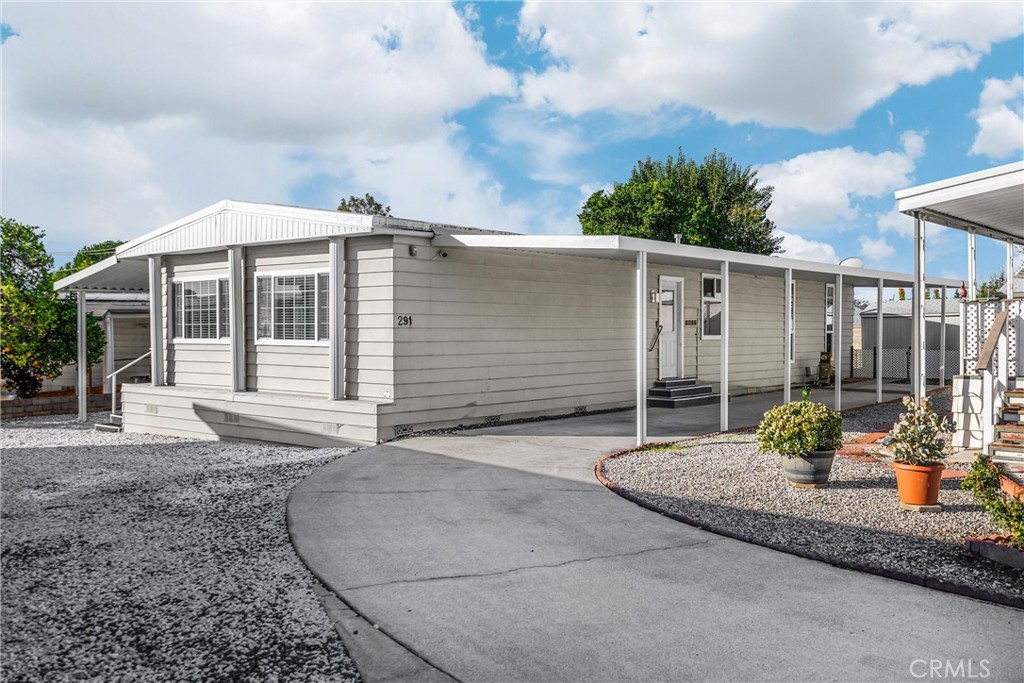 10210 Base Line Road, Unit 291 Rancho Cucamonga, CA 91701 - Photo 2 of 27 a front view of a house with garden