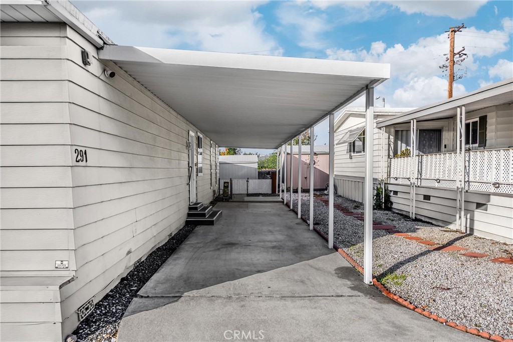10210 Base Line Road, Unit 291 Rancho Cucamonga, CA 91701 - Photo 23 of 27 a view of a house with a garage