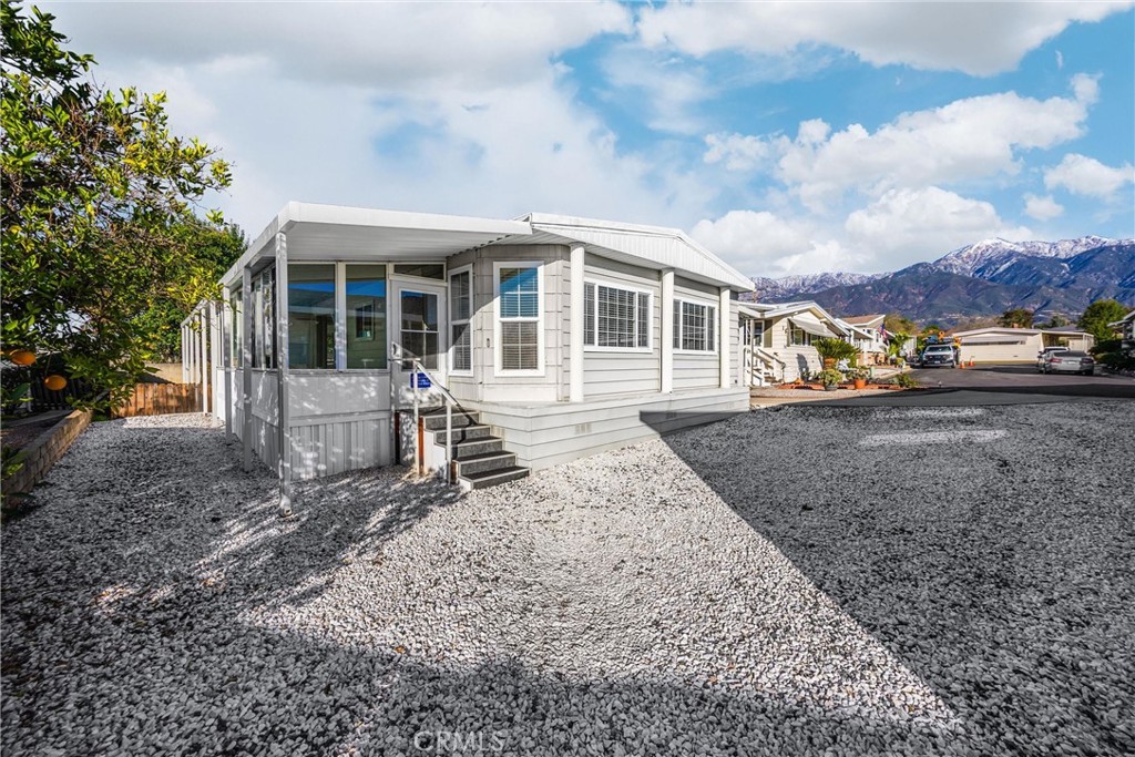 10210 Base Line Road, Unit 291 Rancho Cucamonga, CA 91701 - Photo 3 of 27 a view of a house with a yard