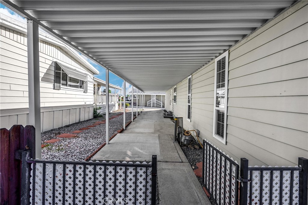 10210 Base Line Road, Unit 291 Rancho Cucamonga, CA 91701 - Photo 4 of 27 a view of a porch with wooden stairs