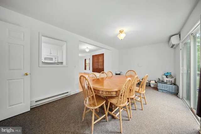 a view of living room with furniture and a window