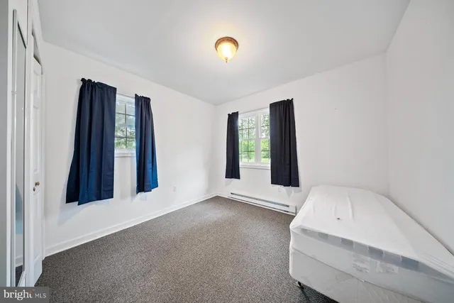 a spacious bathroom with a bathtub and a shower