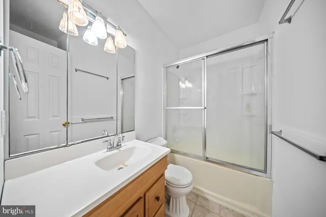 a bedroom with double bed and a window