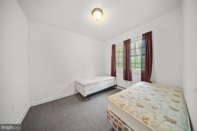 a room with a bed and a window