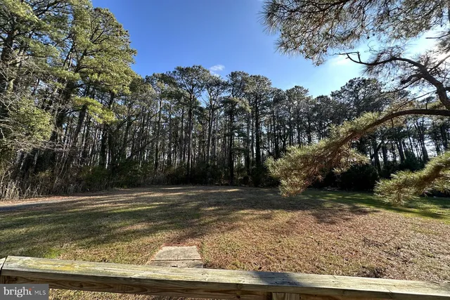 a front view of a house with parking space